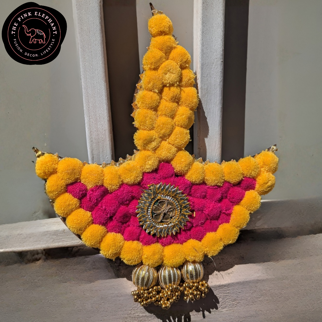Pink and Yellow Pom Pom Diya Rangoli